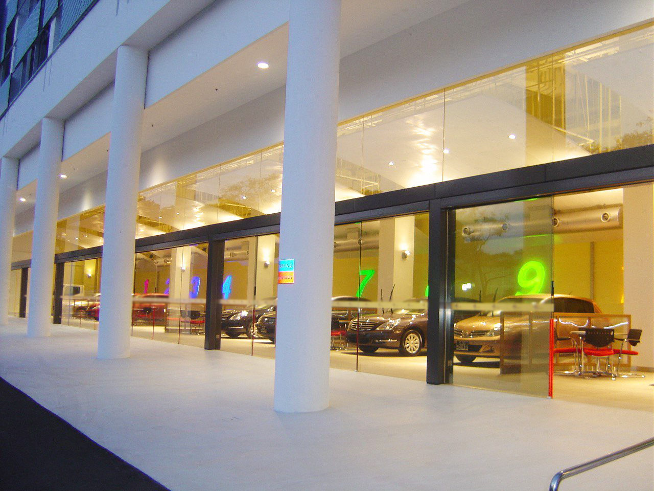 Floor-to-ceiling glass facade of the automotive showroom for rent at 1 Sixth Lok Yang Road Singapore