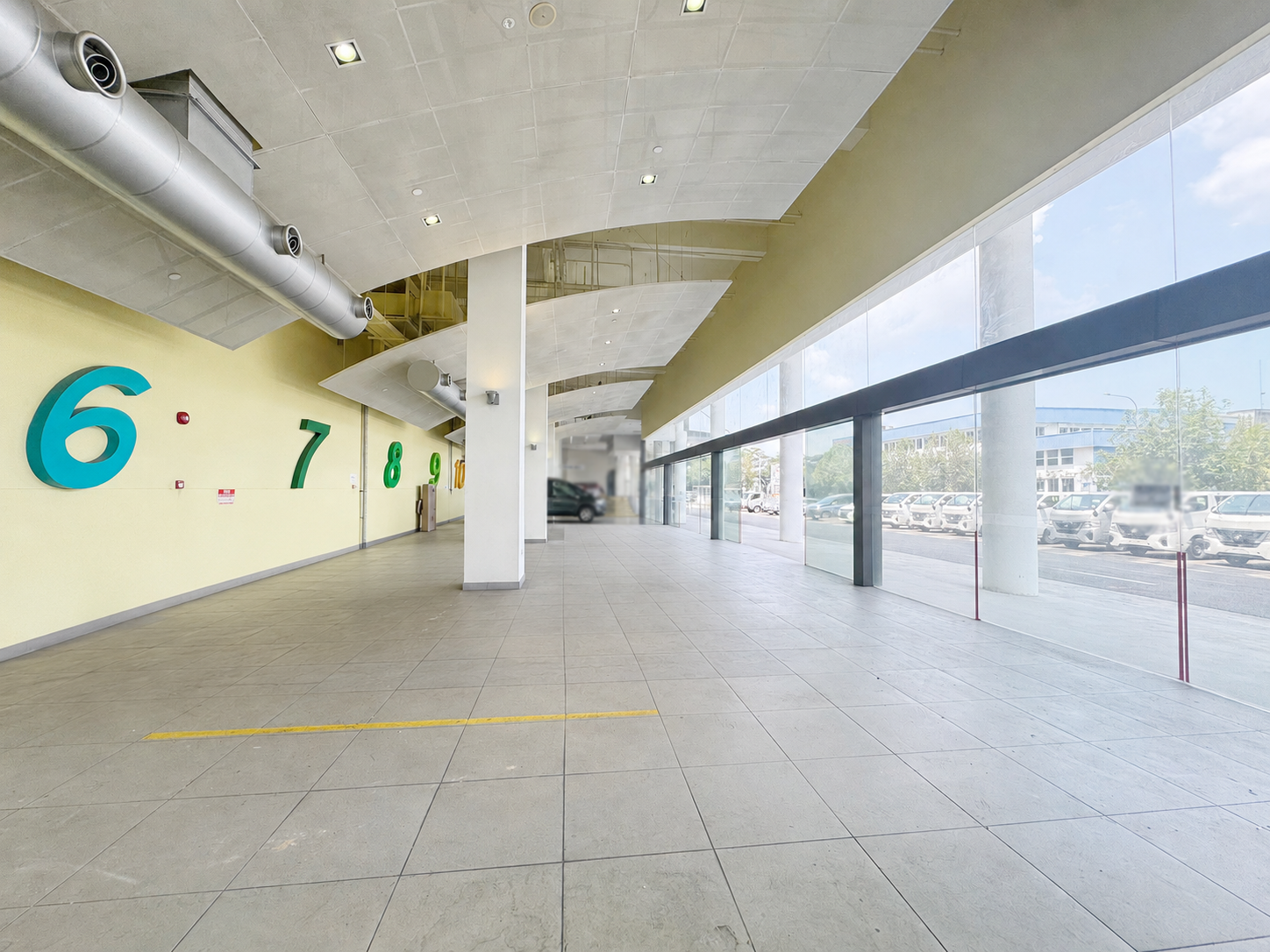 Ready-fitted showroom interior with numbered vehicle display bays at 1 Sixth Lok Yang Road